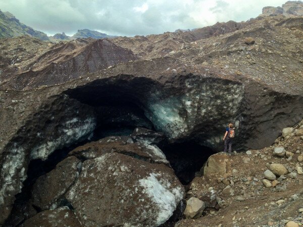 Jonathan stands next to the margin of Falljökull, a glacier with extensive debris cover.
